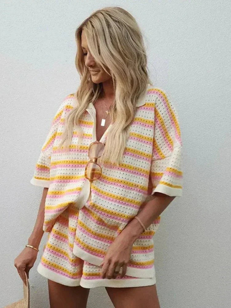 Flowing abstract print set with button-down blouse and high-waisted pants. Lightweight, comfortable, and perfect for summer.