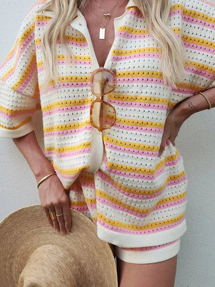 Flowing abstract print set with button-down blouse and high-waisted pants. Lightweight, comfortable, and perfect for summer.