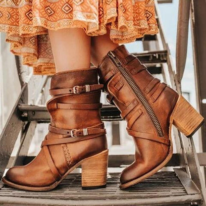 Women's distressed leather ankle boots with chunky heels and buckled straps