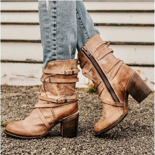 Women's distressed leather ankle boots with chunky heels and buckled straps