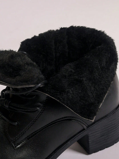 Black leather boot with plush lining on a light gray background Nushes 