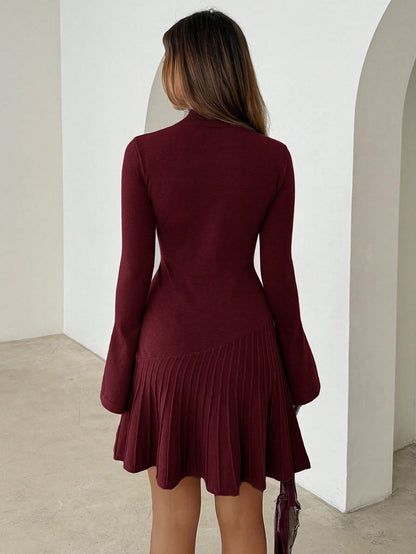 Woman wearing long turtleneck knitted dress facing forward