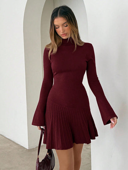 Woman wearing long turtleneck knitted dress facing forward