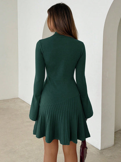 Woman wearing long turtleneck knitted dress facing forward