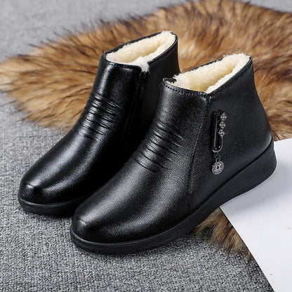 Women's suede ankle boots with side zip fastening, soft lining and metallic detail