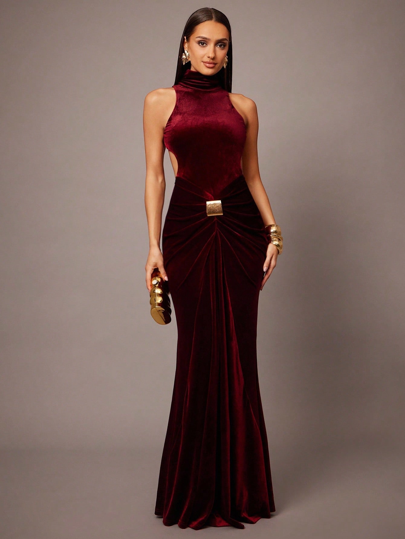 Elegant women’s velvet maxi dress with high neck and open back, designed for evening and formal events.