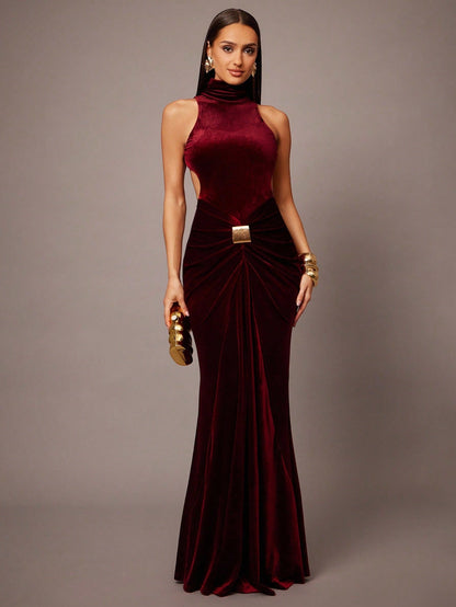 Elegant women’s velvet maxi dress with high neck and open back, designed for evening and formal events.